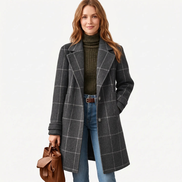 Model wearing the charcoal gray checked coat with a hand in pocket, studio shot on white 15