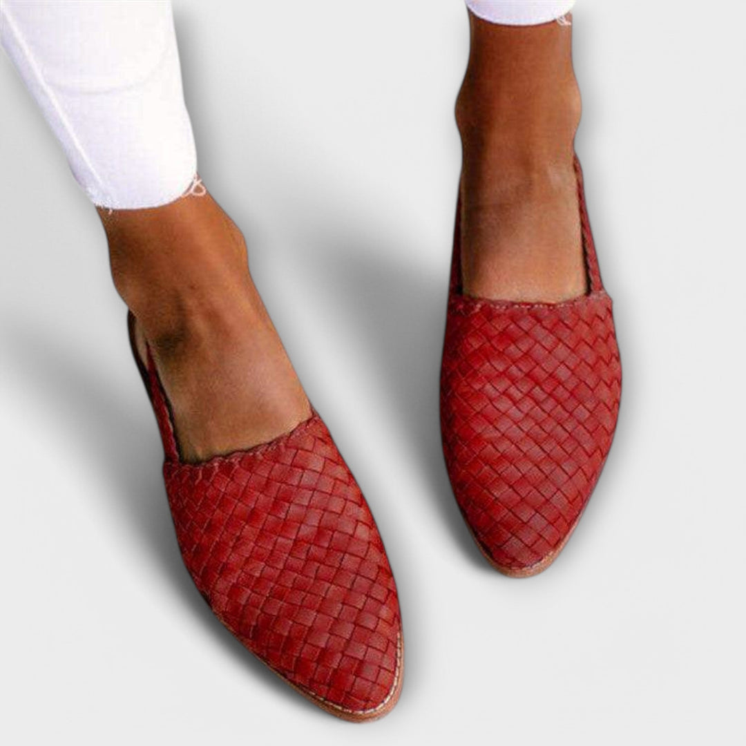 Red woven pointed-toe flats, another view.