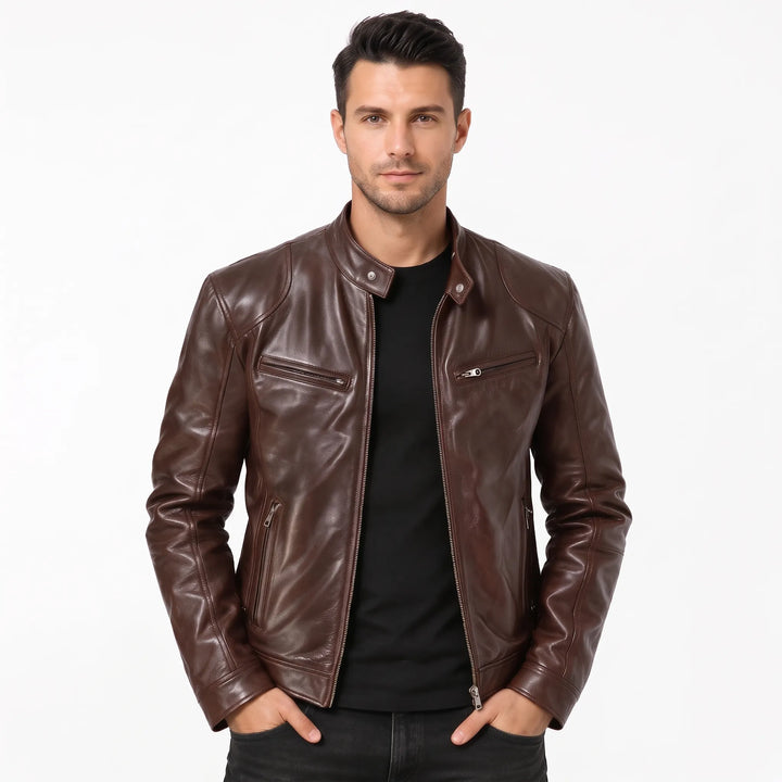 Model in a dark brown leather biker jacket over a black tee, hands in pockets 16