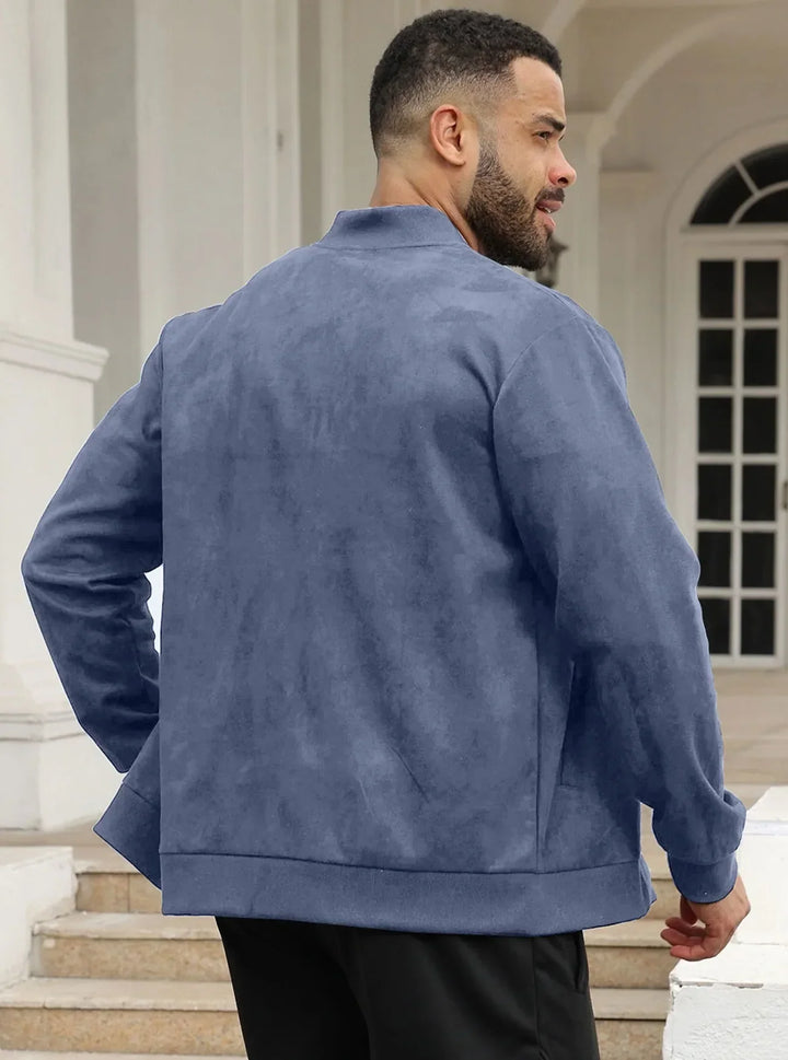 Back view of a man wearing the blue jacket, standing on steps in front of white columns 16