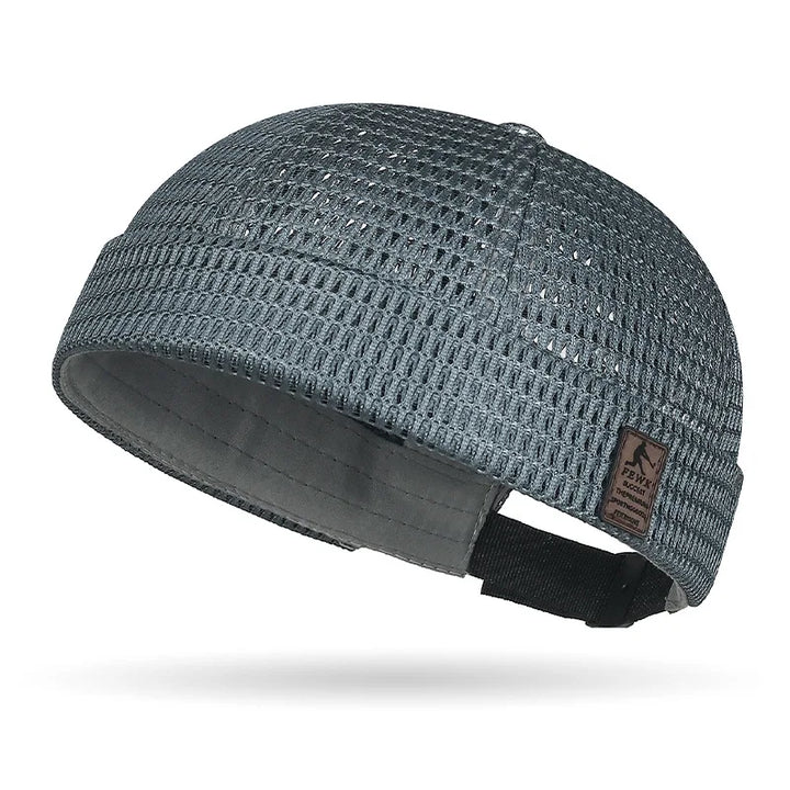 Slate gray open weave brimless cap with small leather patch and black adjustable rear strap 16