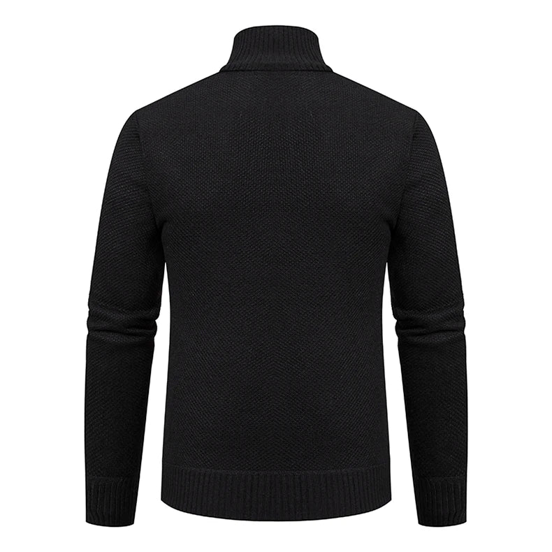 Back view of the black knit cardigan showing the textured weave and ribbed stand collar 17