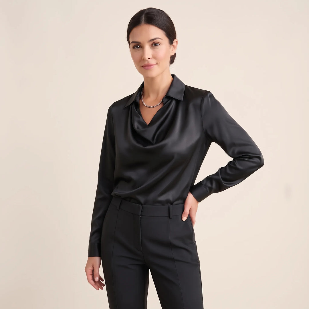 Studio three-quarter view of the black satin blouse with draped collar and black trousers 17