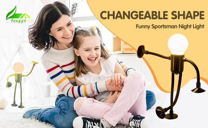 Smiling mother and daughter on a rug, with a bronze-toned figure light displayed in two poses beside them 17