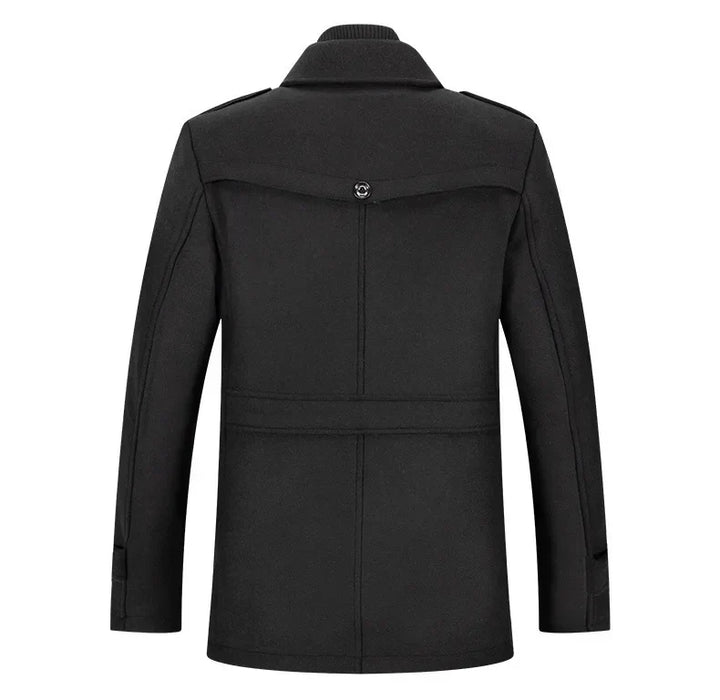 Back view of the black overcoat, showing the buttoned yoke, waist strap and shoulder epaulets 17