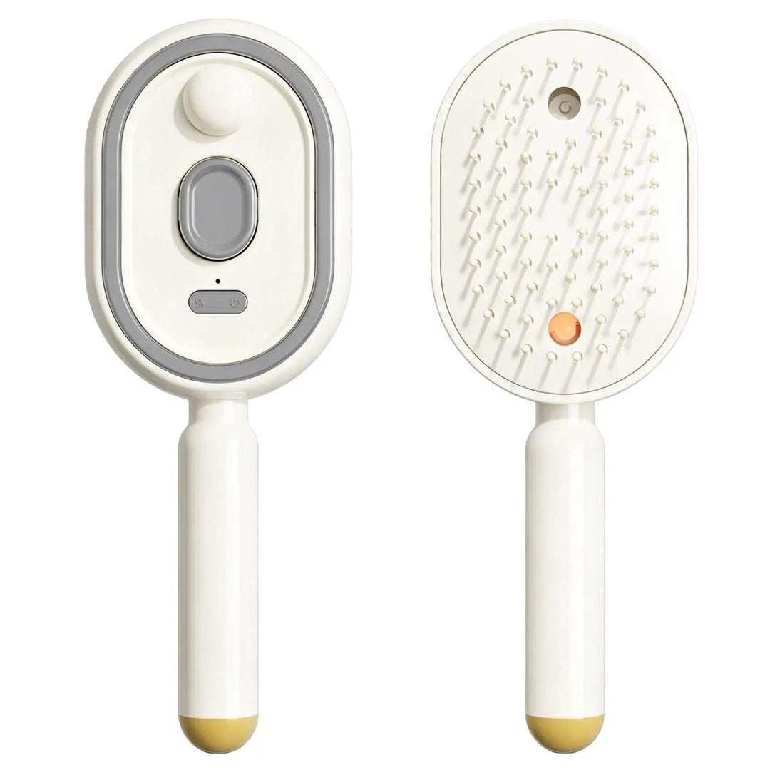 Cream comb shown front and back, revealing the top button panel and the bristle side with mist outlet and orange light, with a yellow handle tip. 16