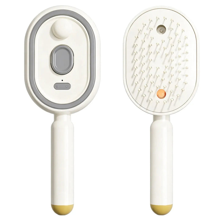 Cream comb shown front and back, revealing the top button panel and the bristle side with mist outlet and orange light, with a yellow handle tip. 16