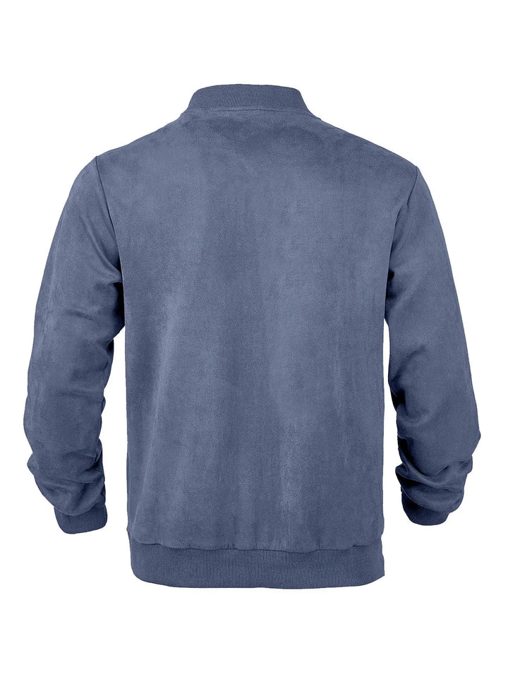 Back view of the blue jacket laid flat, showing the plain back panel and ribbed hem 18