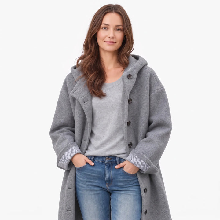Studio shot of the gray hooded coat worn open over a gray tee and jeans 18