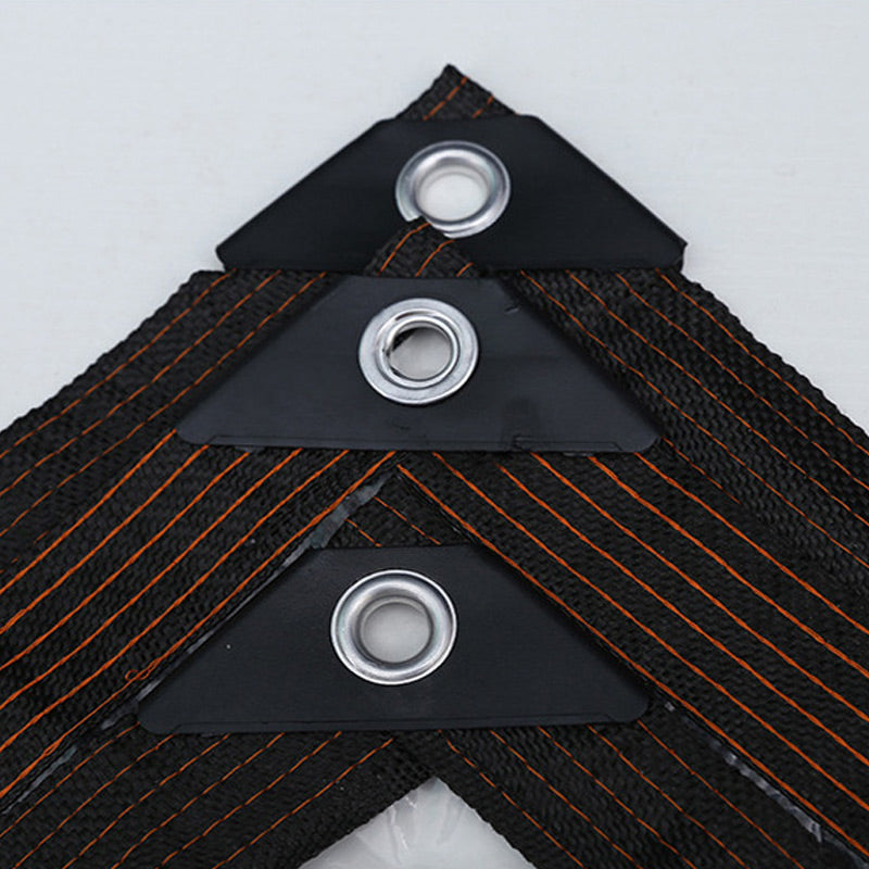 Close-up of black corner reinforcements with metal eyelets on the border.
