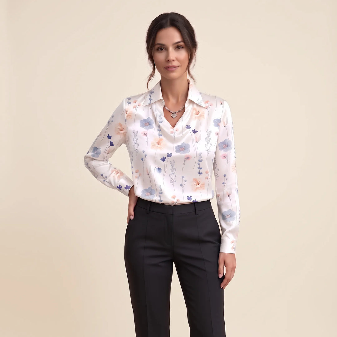 Studio view of the white satin blouse with delicate blue and peach wildflower print, black trousers 19