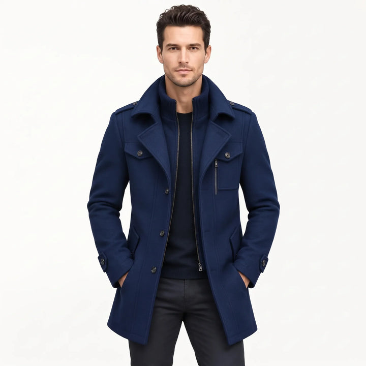 Model wears the navy coat open over a dark sweater with hands in pockets 19