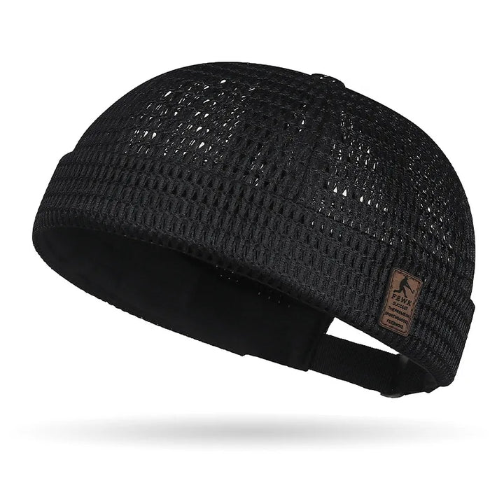 Black open weave brimless cap with small leather patch and black adjustable rear strap 19