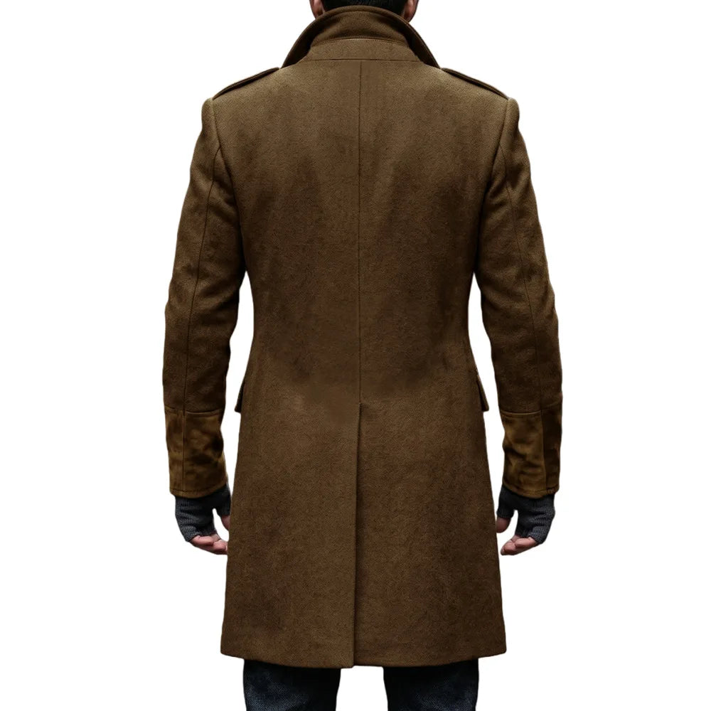 Back view of the brown overcoat on a model with fingerless gloves, showing the center vent and shoulder epaulettes 19