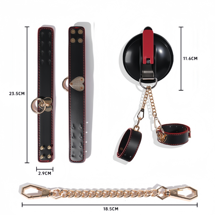 Dimension diagram of black faux leather cuffs with red edge stitching and heart-shaped gold-tone fittings, with a suction mount and gold chain. 7