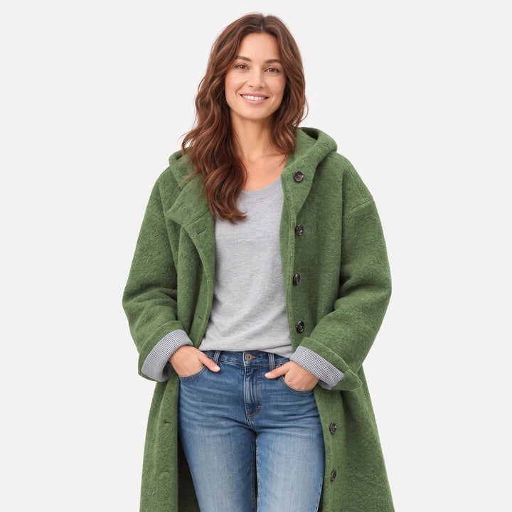 Green textured hooded coat worn open over a gray tee and jeans, cropped at the hips 1