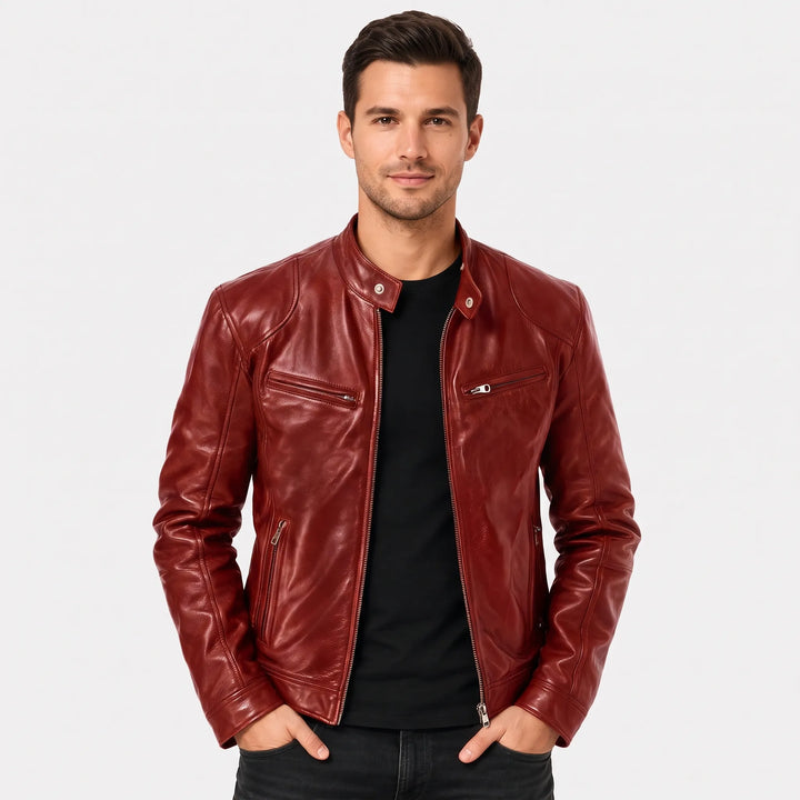 Smiling model in a glossy red leather biker jacket over a black tee, hands in pockets 1