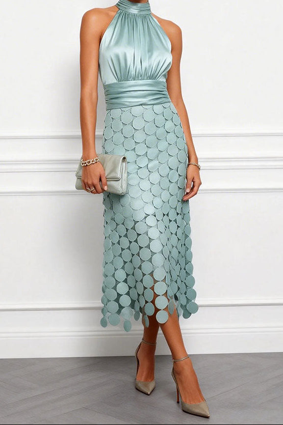 Halter Satin Midi Occasion Dress with Appliqué Skirt in soft sage-green with a matching pale green clutch and taupe ankle-strap heels.