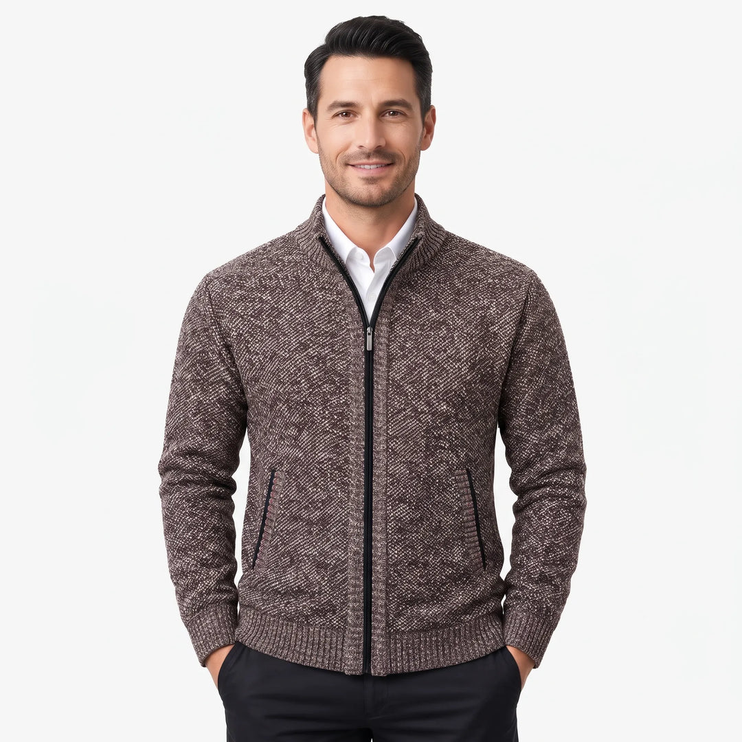 Smiling man wearing the brown speckled knit zip cardigan over a white shirt, hands in pockets 1