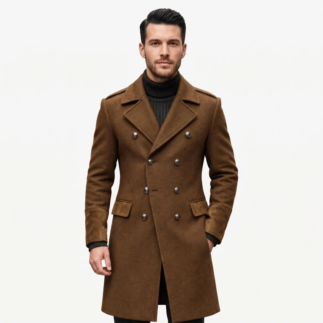 Model in a brown double-breasted overcoat with metal buttons and suede-look cuffs over a dark turtleneck 1
