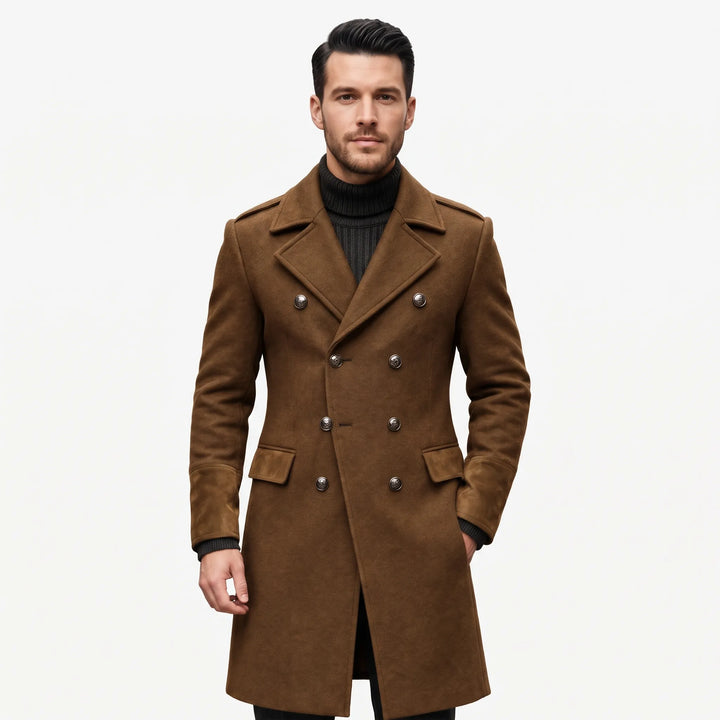 Model in a brown double-breasted overcoat with metal buttons and suede-look cuffs over a dark turtleneck 1