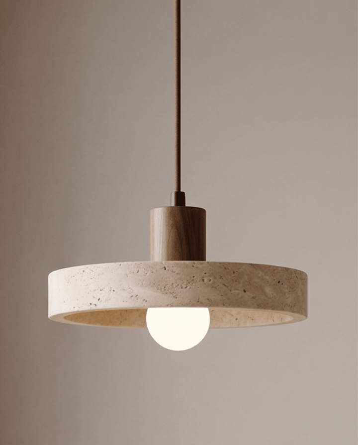 Travertine pendant light with a dark walnut-toned wood cylinder and globe bulb, lit front view.