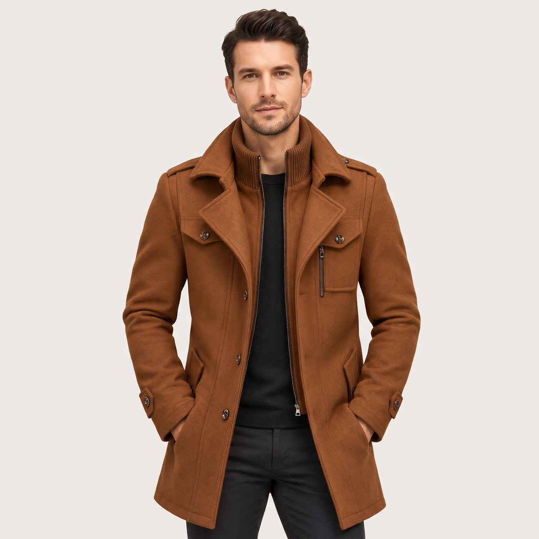Model wears the camel brown coat open over a black sweater, hands in pockets 1
