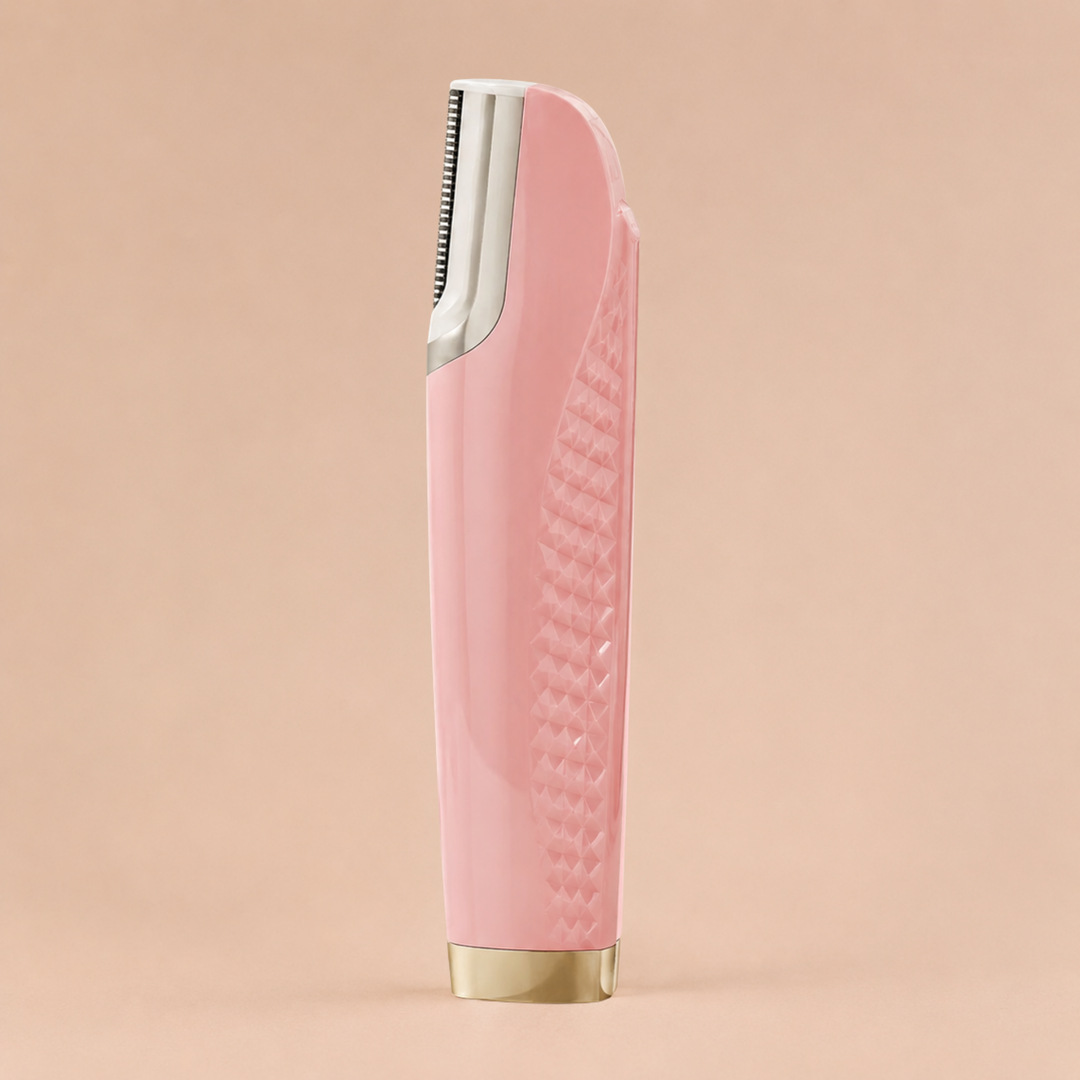 Pink facial hair remover standing upright, showing its textured diamond-pattern grip, silver blade head and gold base.