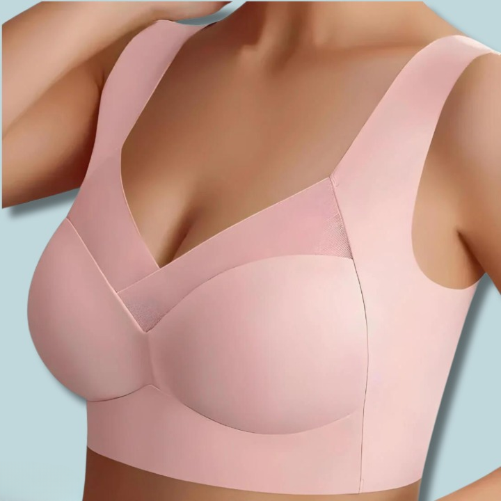 Seamless Ultra-Comfort Bra in pink with smooth seamless cups, crossover mesh insert and wide straps.