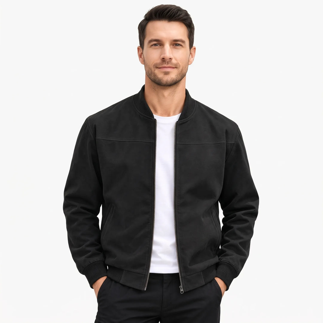 Man in a black suede-look bomber jacket with ribbed collar and cuffs, open over a white tee 1