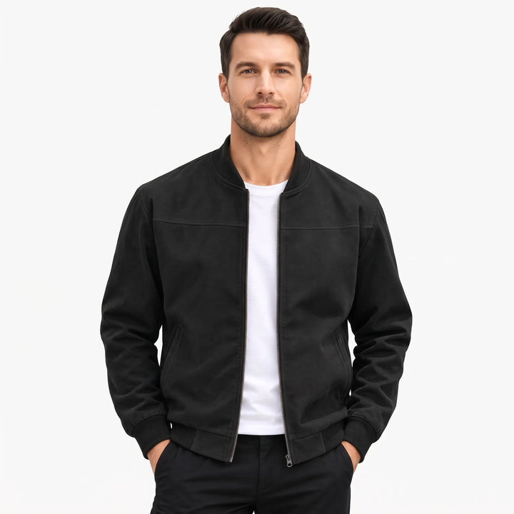 Man in a black suede-look bomber jacket with ribbed collar and cuffs, open over a white tee 1