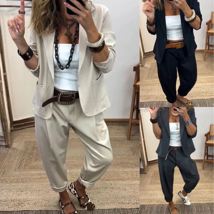 Another view of the suit set in beige, black and dark gray with a white top.