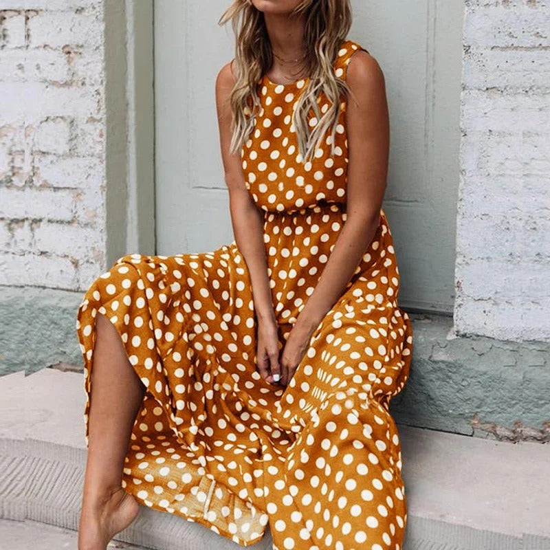 Woman seated on steps in the mustard yellow polka dot version, skirt draped over the stairs 3