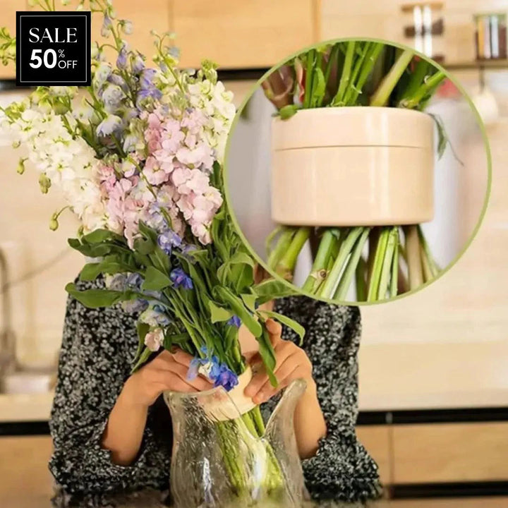 Beige flower arranger vase insert holding stems upright in a glass vase
