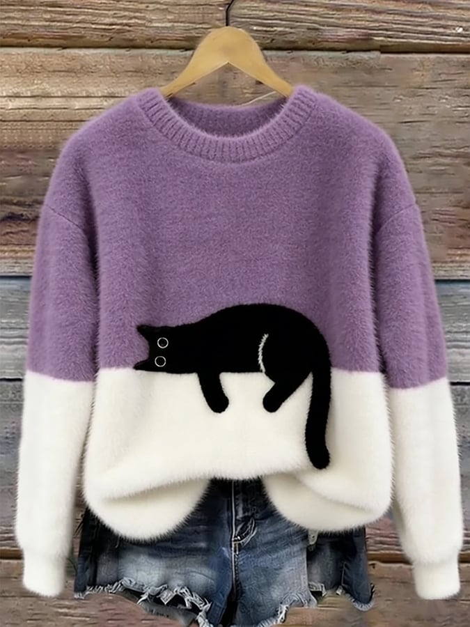 Lavender and white fuzzy colorblock sweater with a black cat resting on the lower half, displayed on a hanger by wooden planks. 11