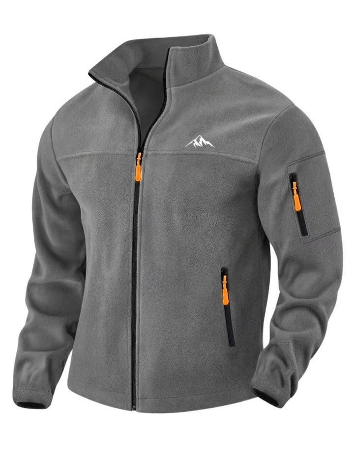 Front view of the medium gray fleece jacket with orange zipper pulls, chest seam and sleeve pocket 5