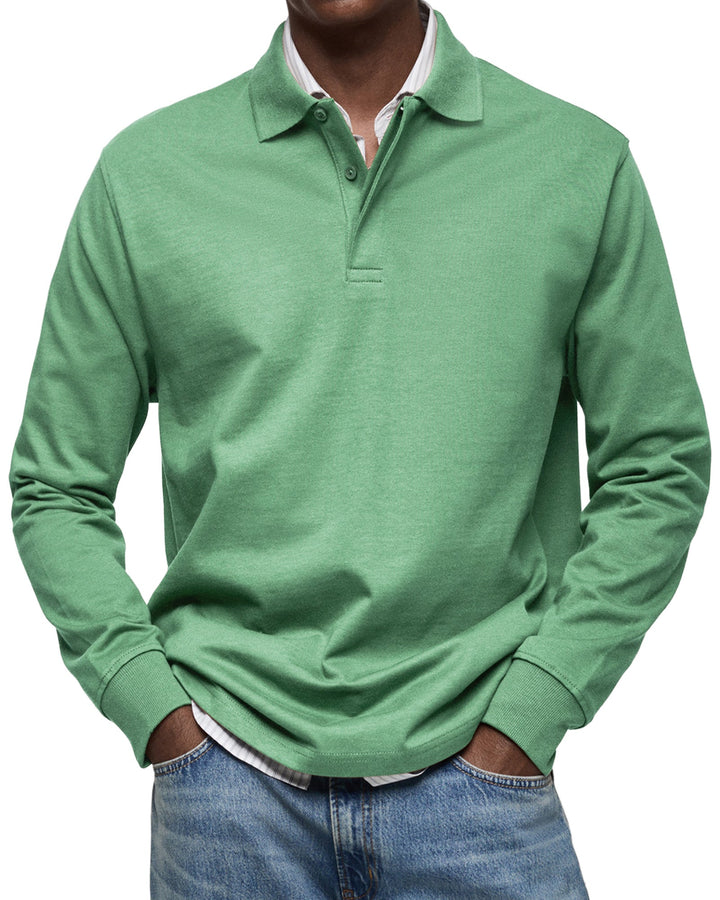 Man wearing the long sleeve polo shirt in soft green, another view.