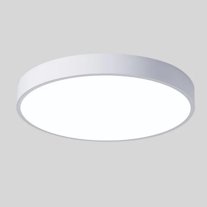 Slim white round ceiling light with a white diffuser, shown from below.