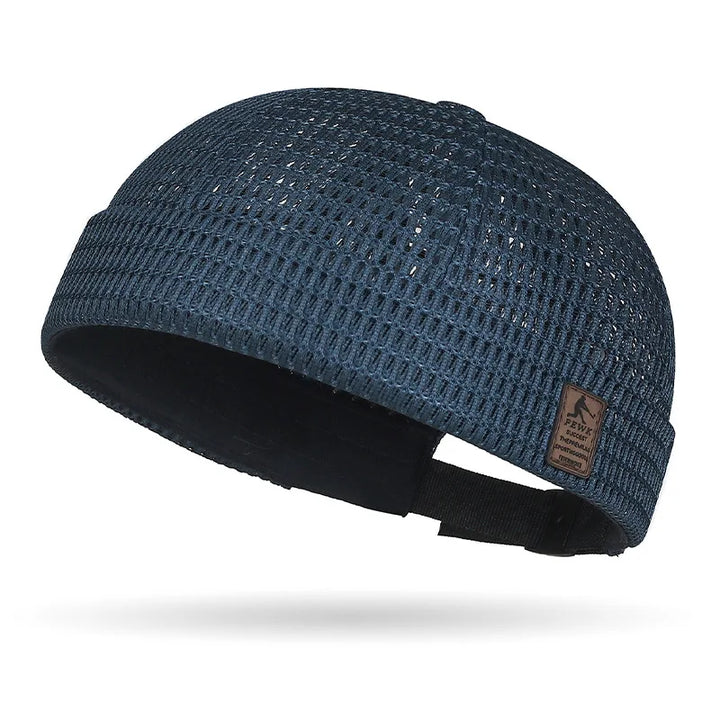 Navy blue open weave brimless cap with leather patch and black adjustable rear strap 20