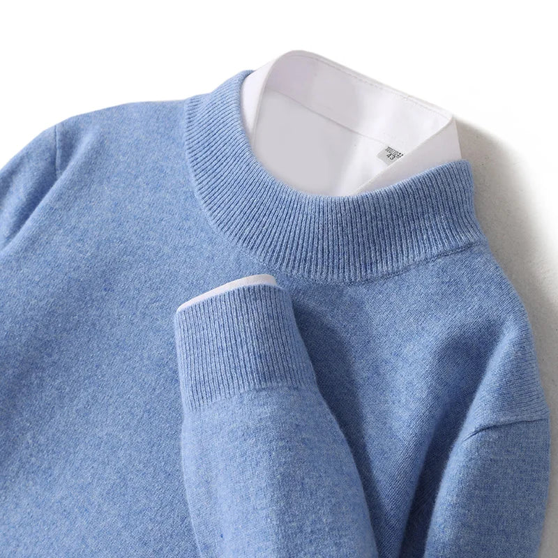 Close-up of a light blue ribbed mock neck collar and folded cuff with white shirt underneath 20