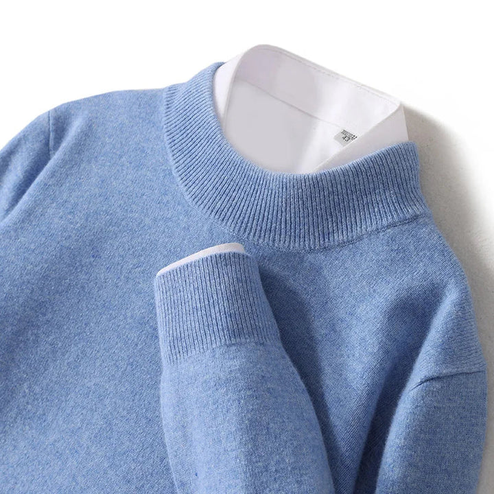Close-up of a light blue ribbed mock neck collar and folded cuff with white shirt underneath 20
