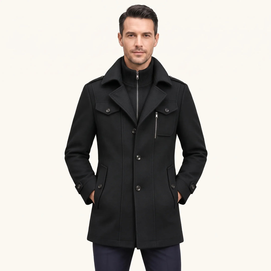Man wearing the black overcoat with hands in pockets, showing the zip-in knit collar and buttons 20