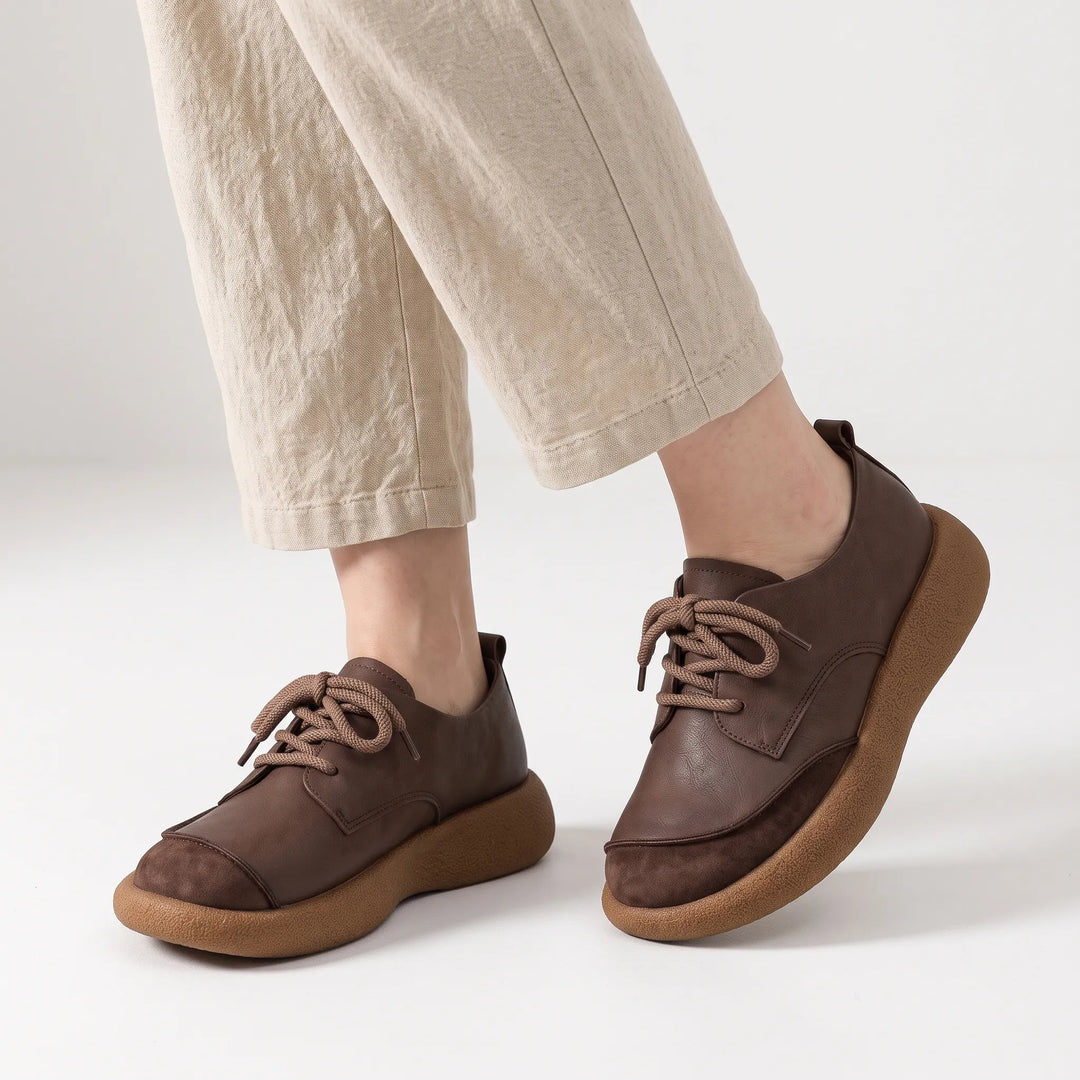 Dark brown lace-up shoes with suede toe caps and chunky soles worn with linen trousers 20