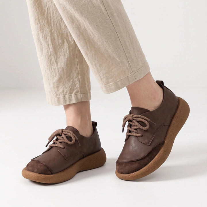 Dark brown lace-up shoes with suede toe caps and chunky soles worn with linen trousers 20