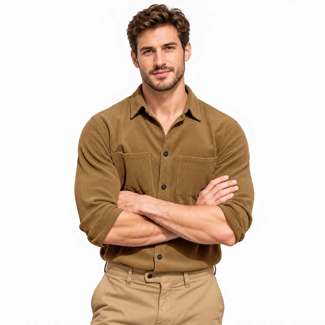 Smiling model with arms crossed wearing the tan ribbed button shirt and khaki pants against white 20