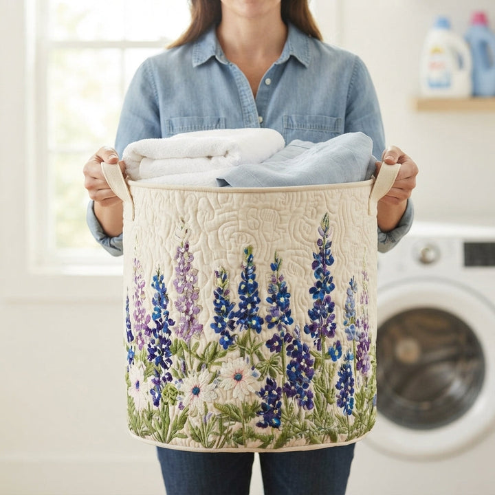 Another view of a woman carrying the quilted laundry basket by its canvas handles.