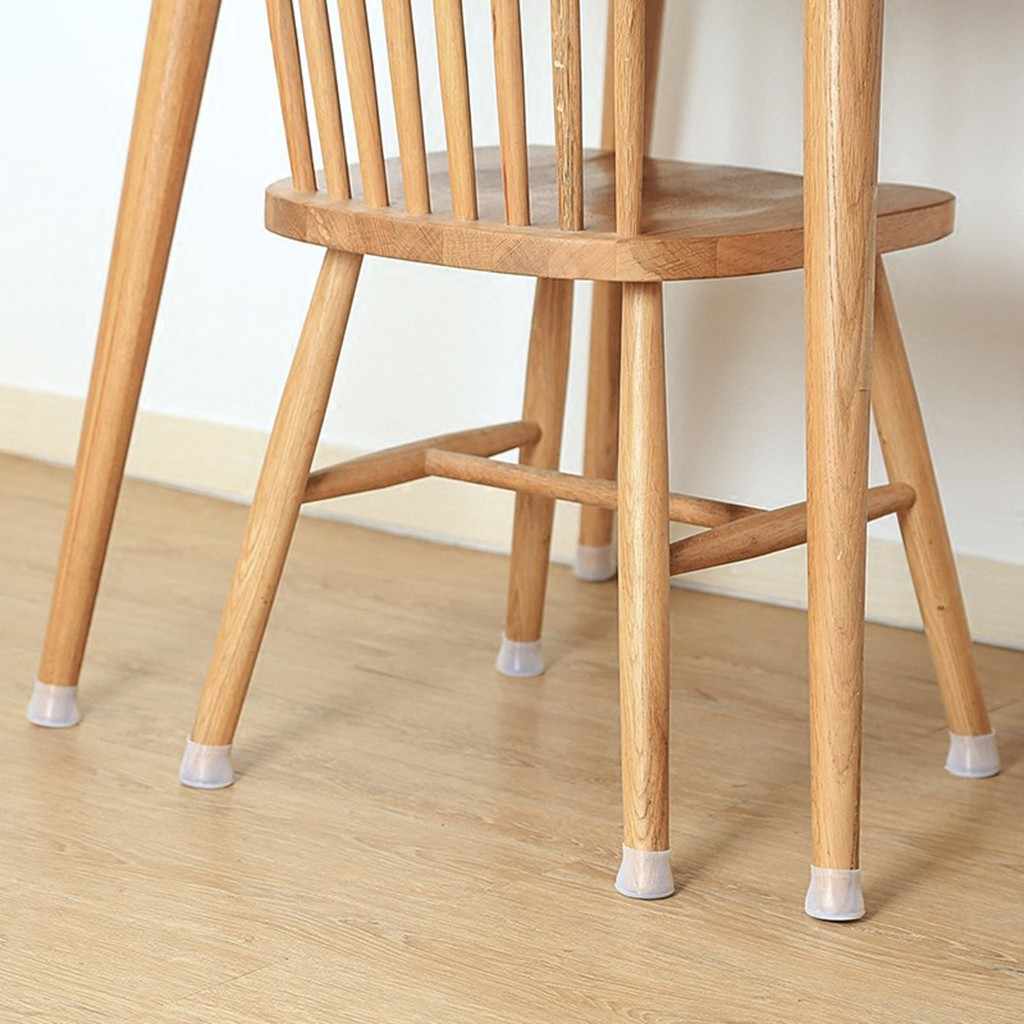 Wooden chair on a light wood floor with a clear silicone cap on each leg 5