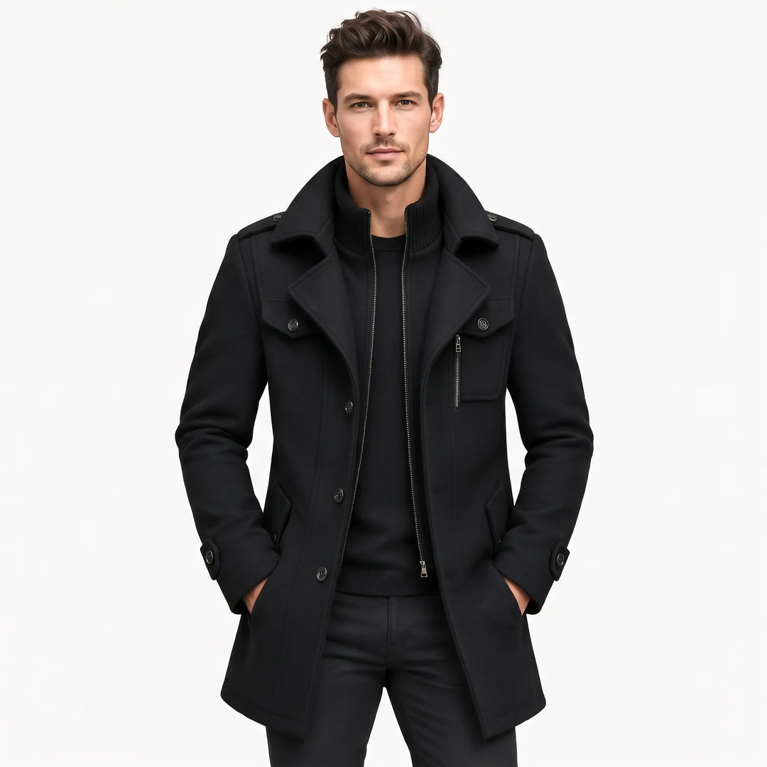 Man wearing the black coat open over a black sweater, hands in pockets, front view 21