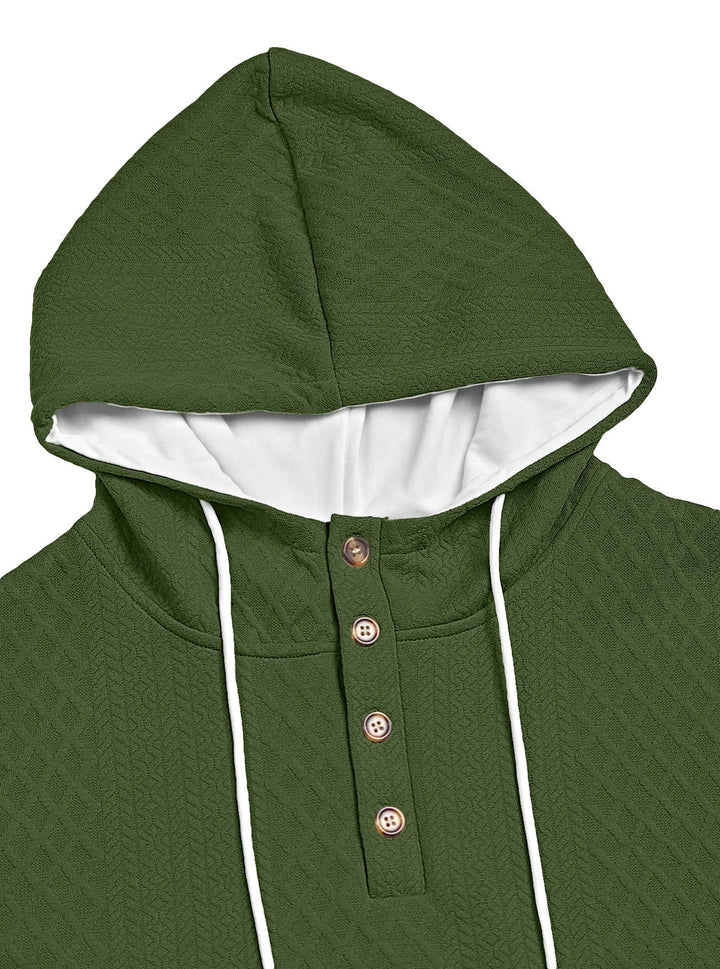 Close-up of the olive green textured hood and four-button placket with white drawstrings 21