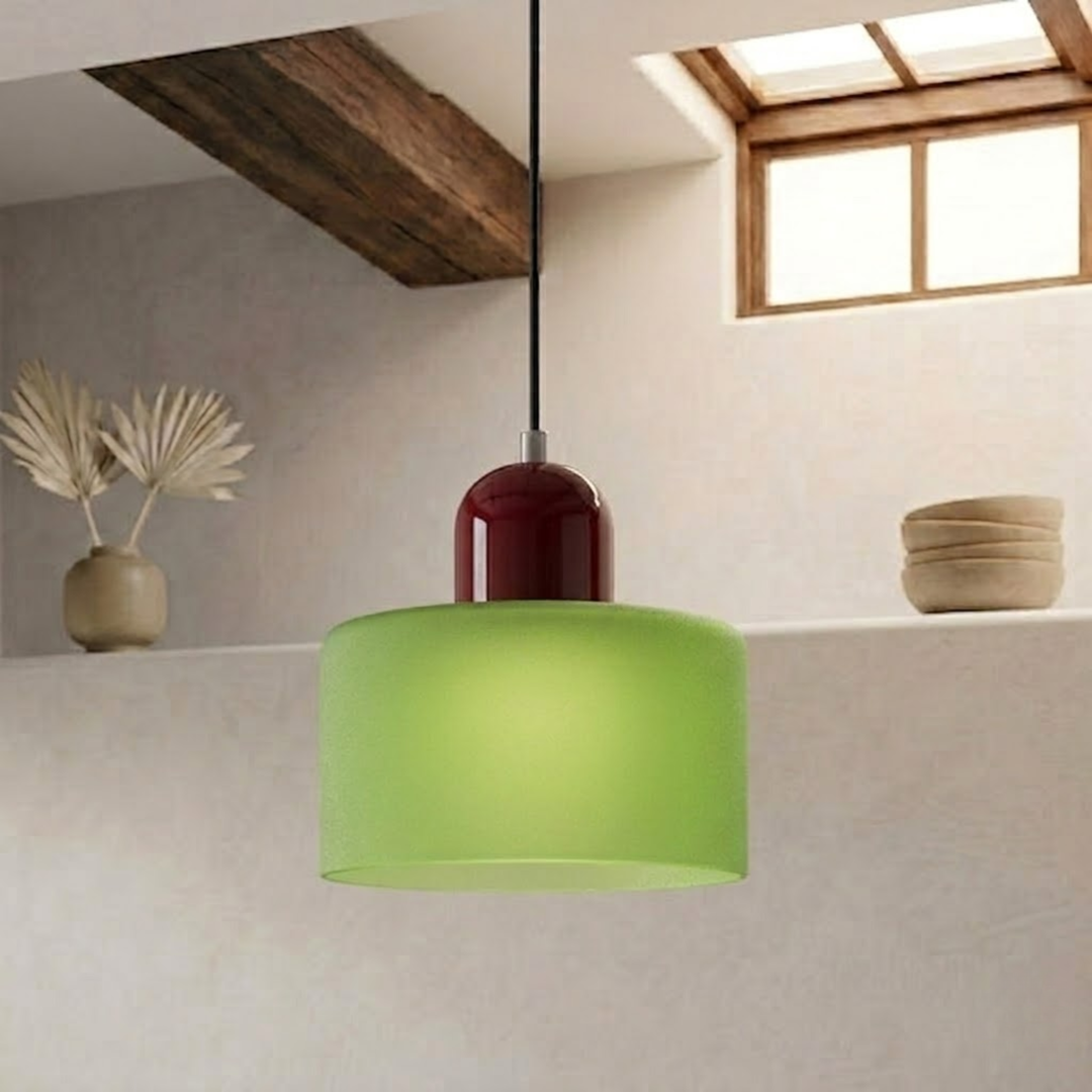 Frosted green drum shade with a deep burgundy dome cap hangs from a black cord near a wood beam. 26